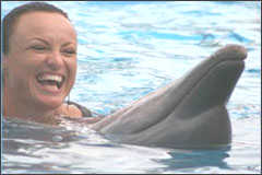 A lady with a dolphin.